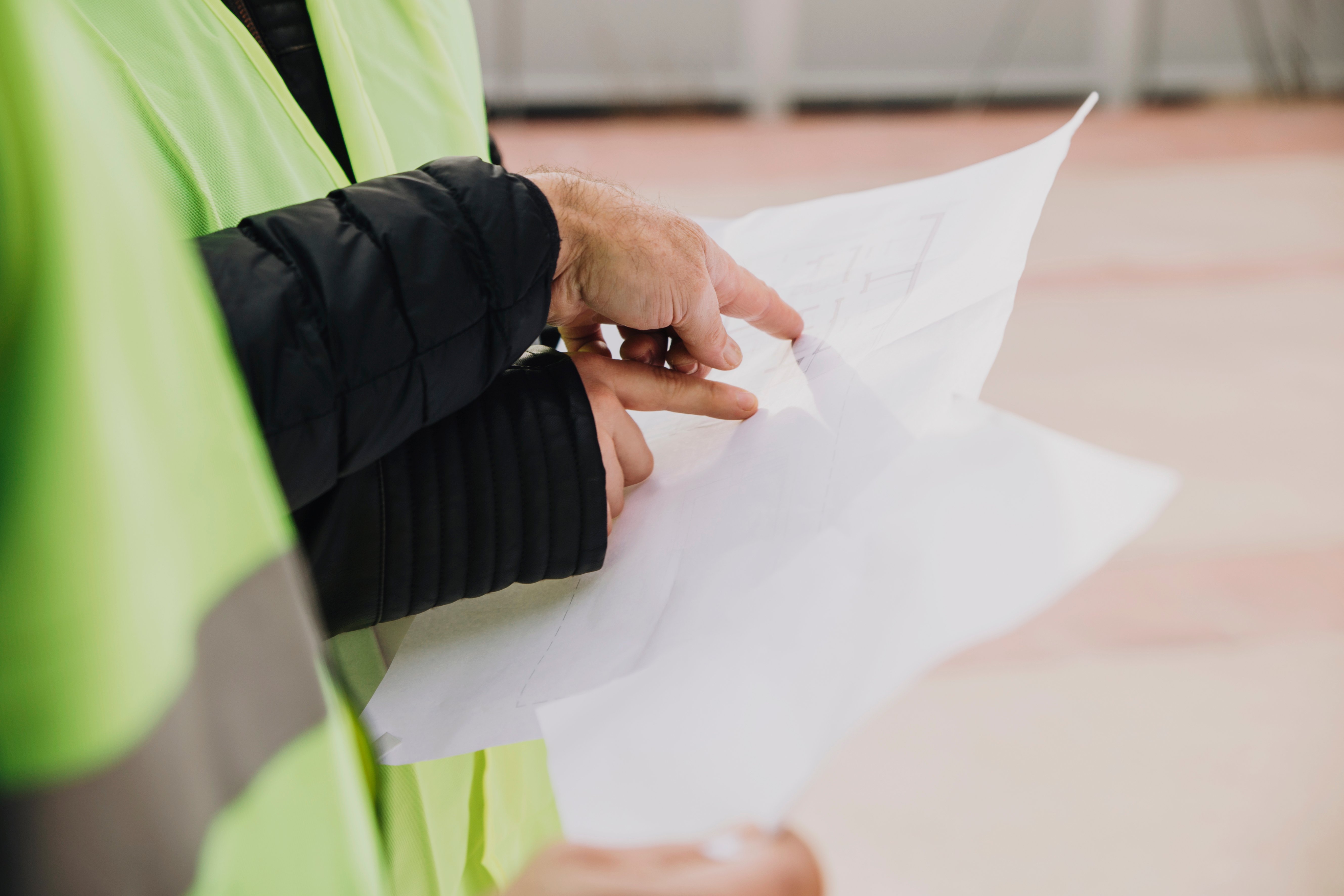health and safety officers pointing at paperwork