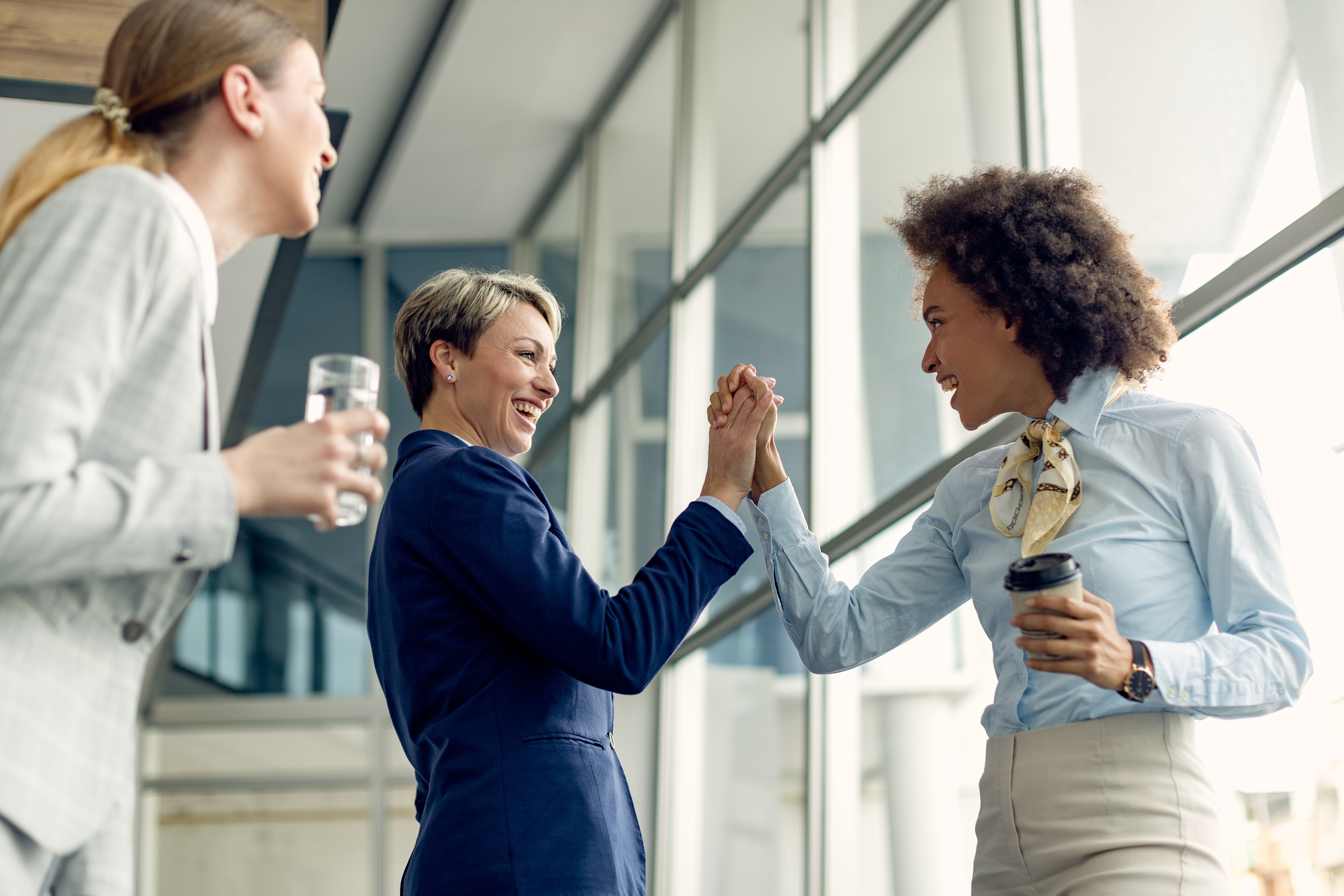 businesswomen celebrating