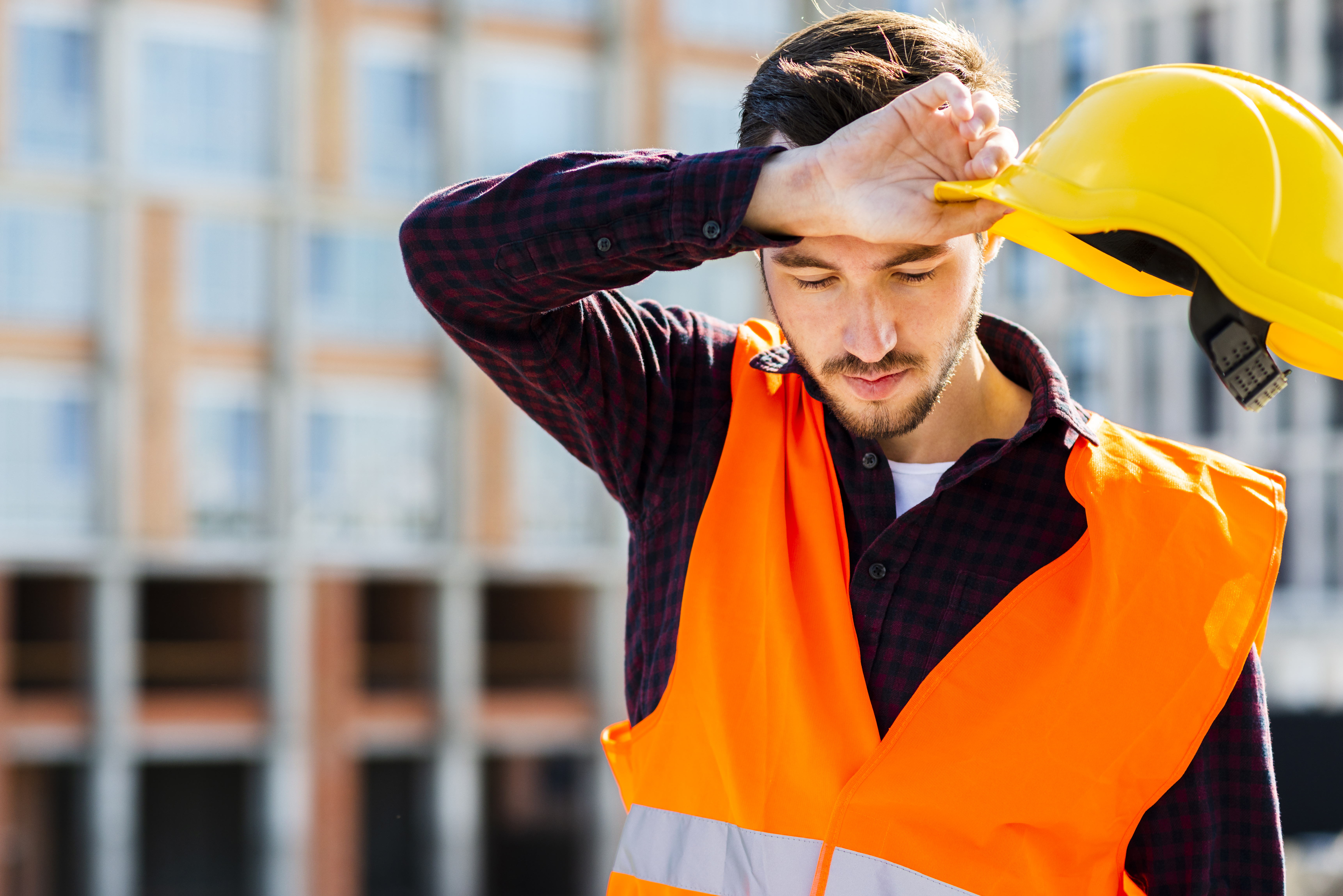 Medium shot portrait of tired construction worker